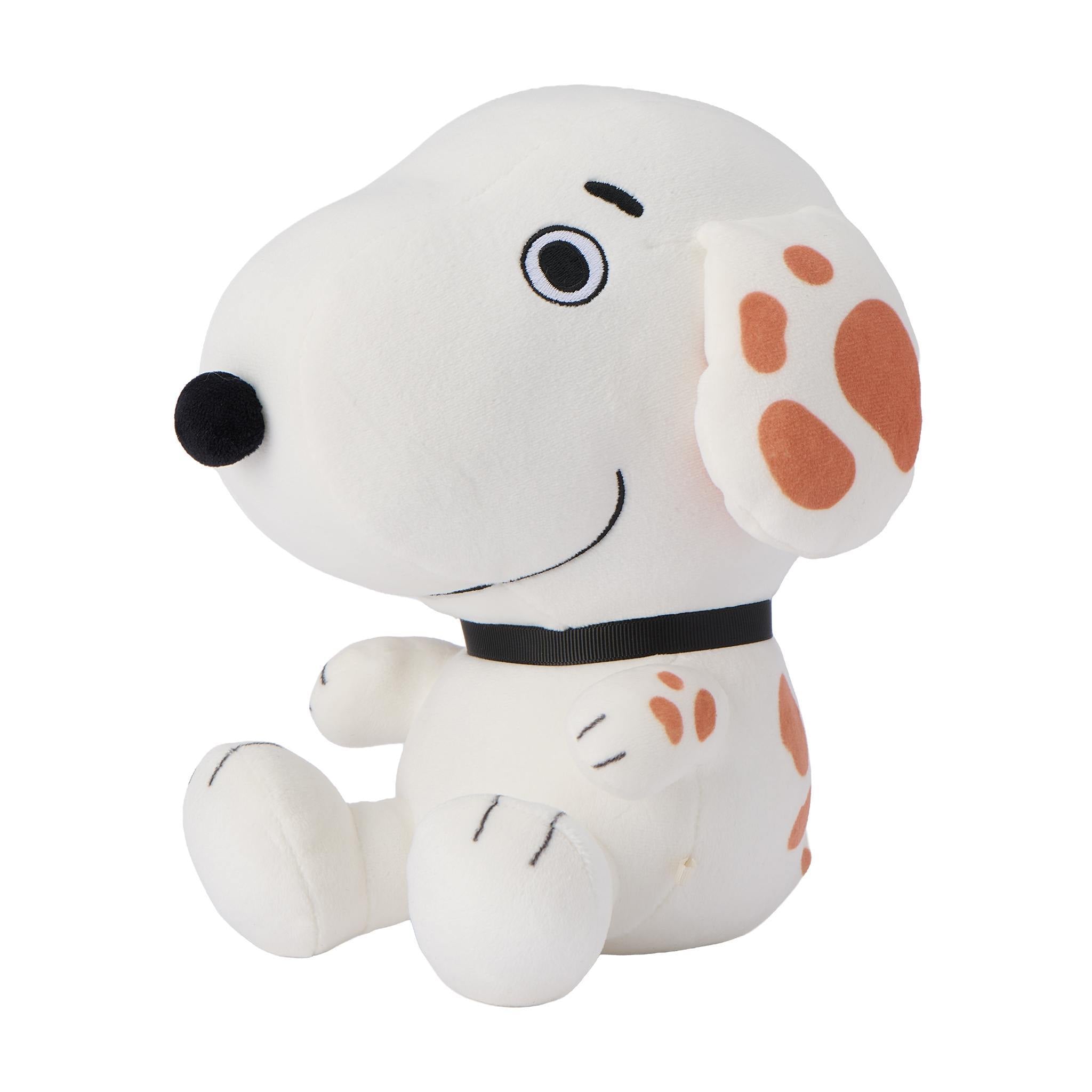 White Snoopy plush with closed eye and a tan fluffy ear