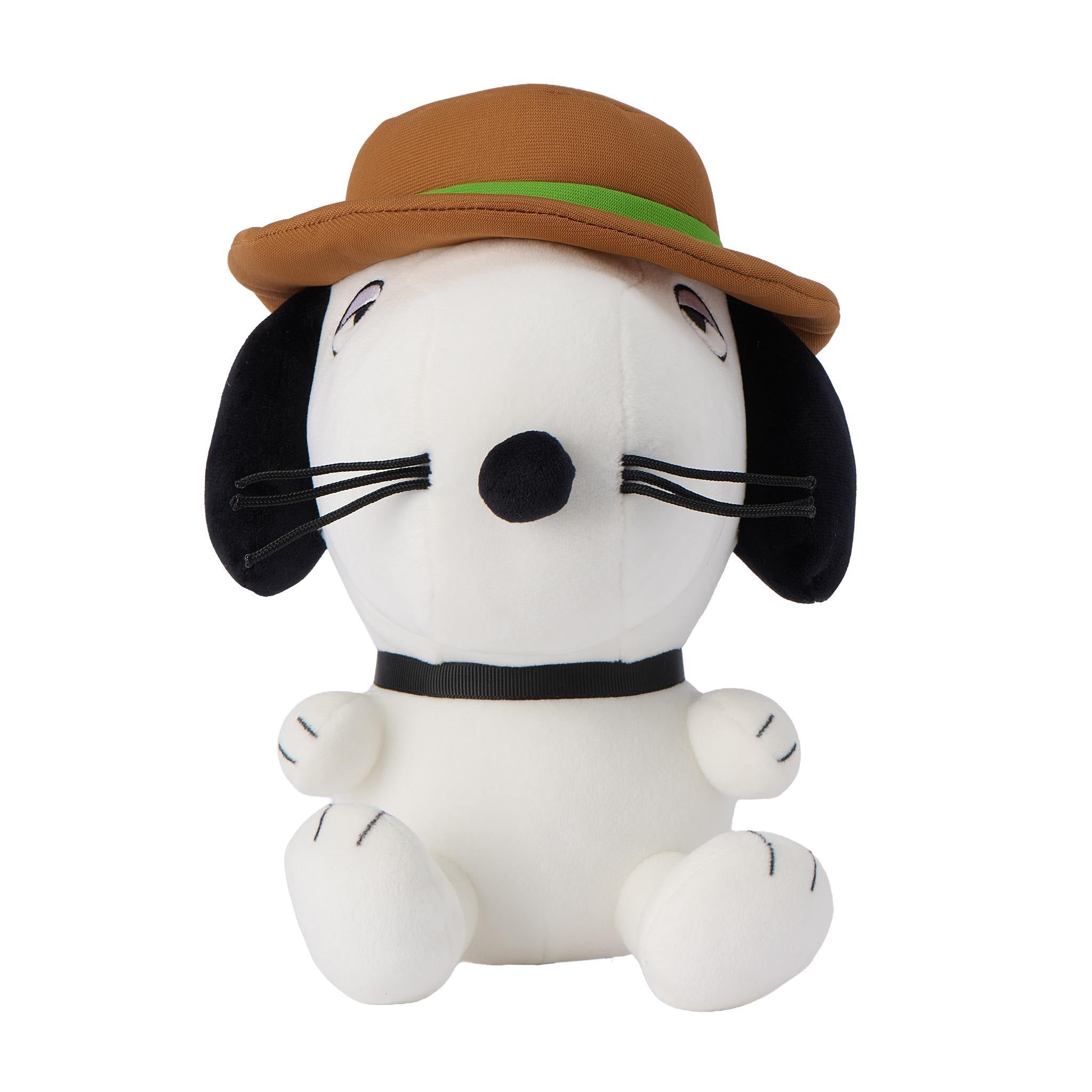 Snoopy plush wearing a brown hat with a green band