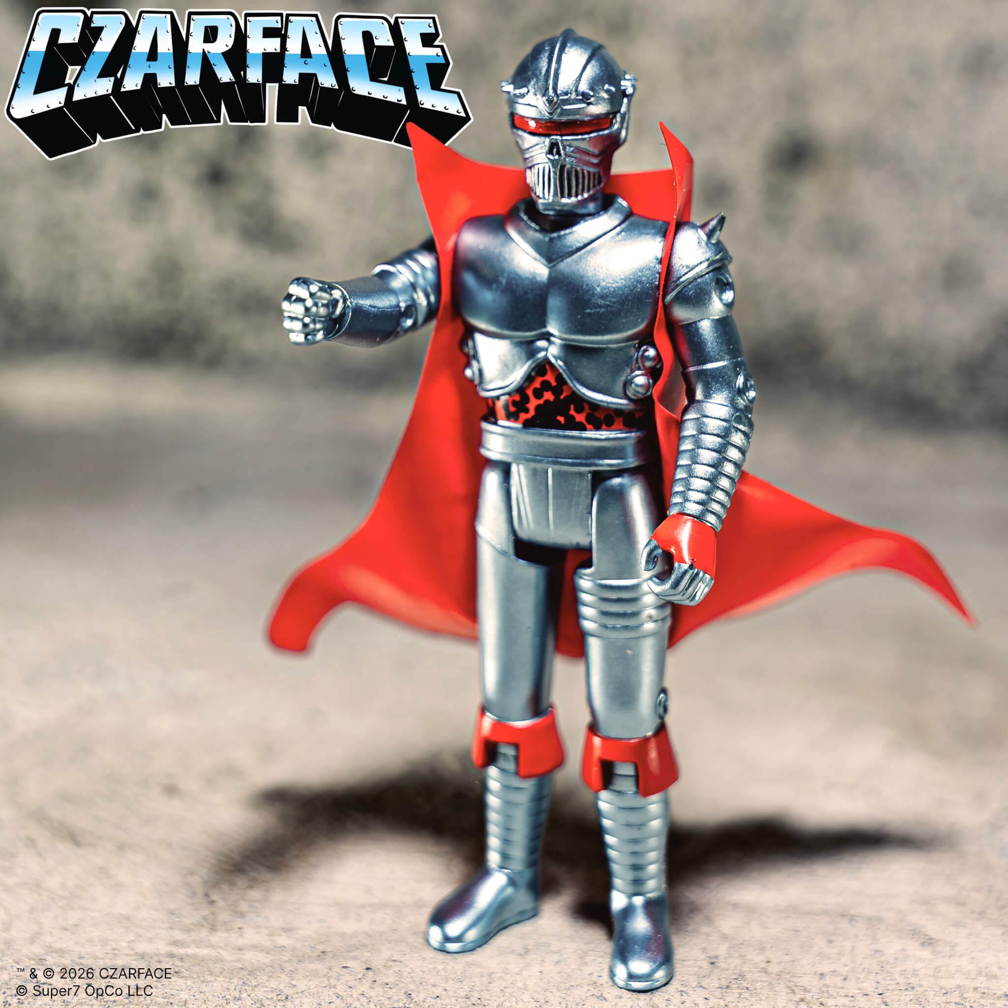 Czarface ReAction Figure with silver armor, red cape, and red accents, standing against a grey background