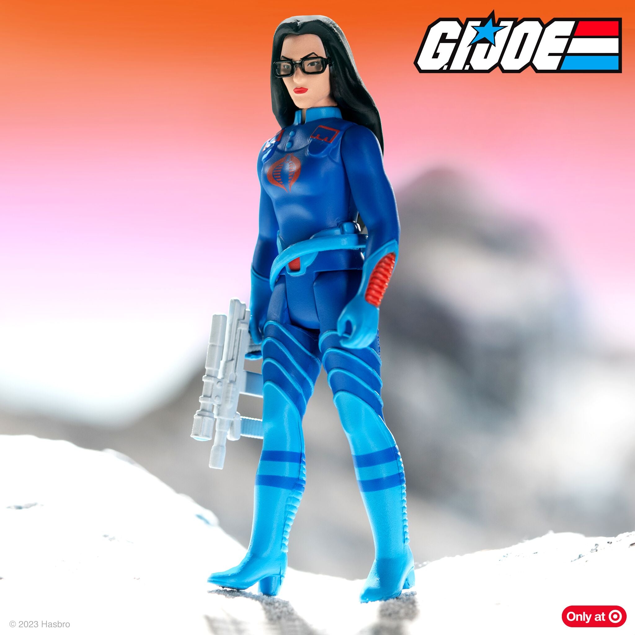 Baroness G.I. Joe ReAction Wave 7 action figure in blue uniform with glasses and red lips against an orange pink gradient.