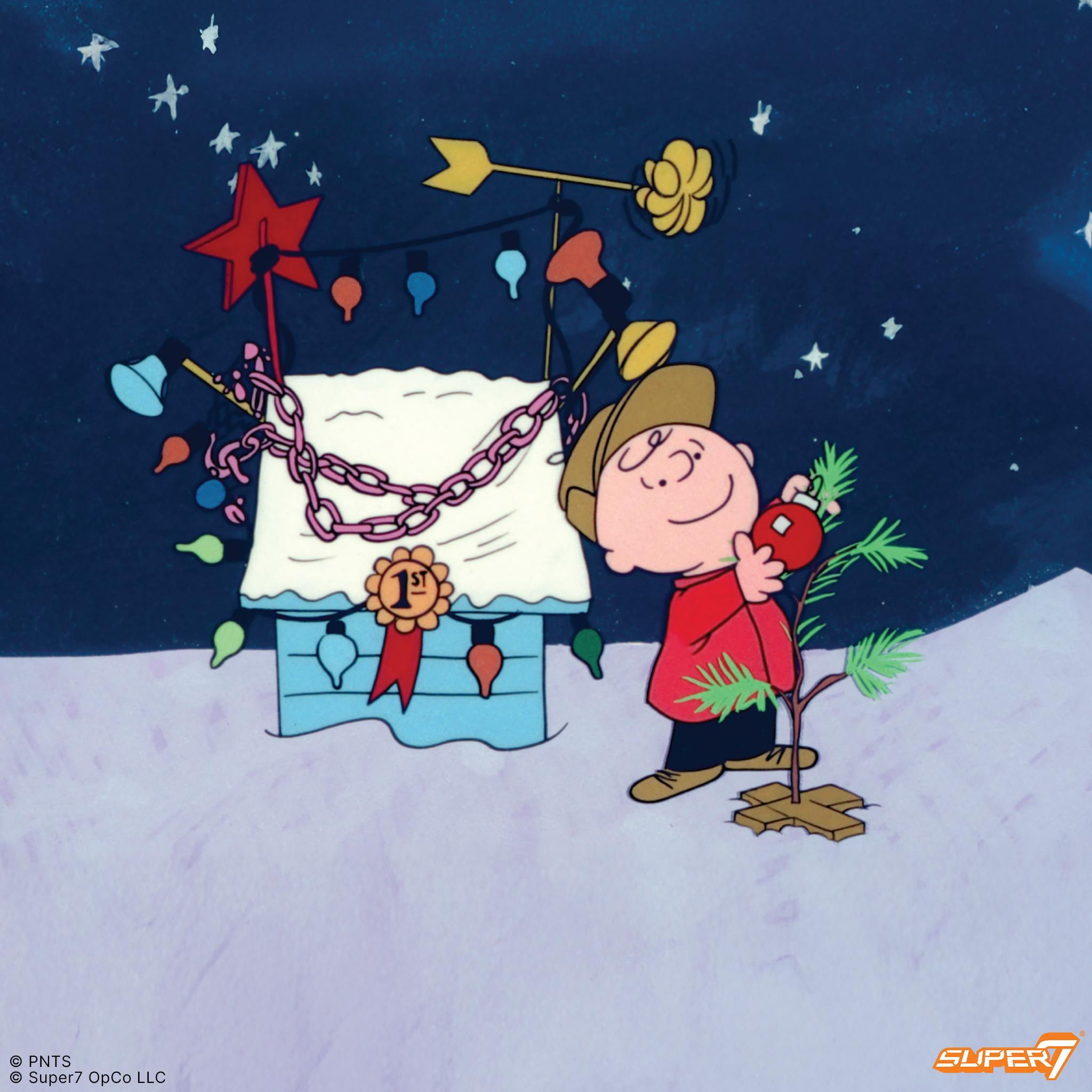 Promotional artwork of Charlie Brown holding the ornament-laden sad tree