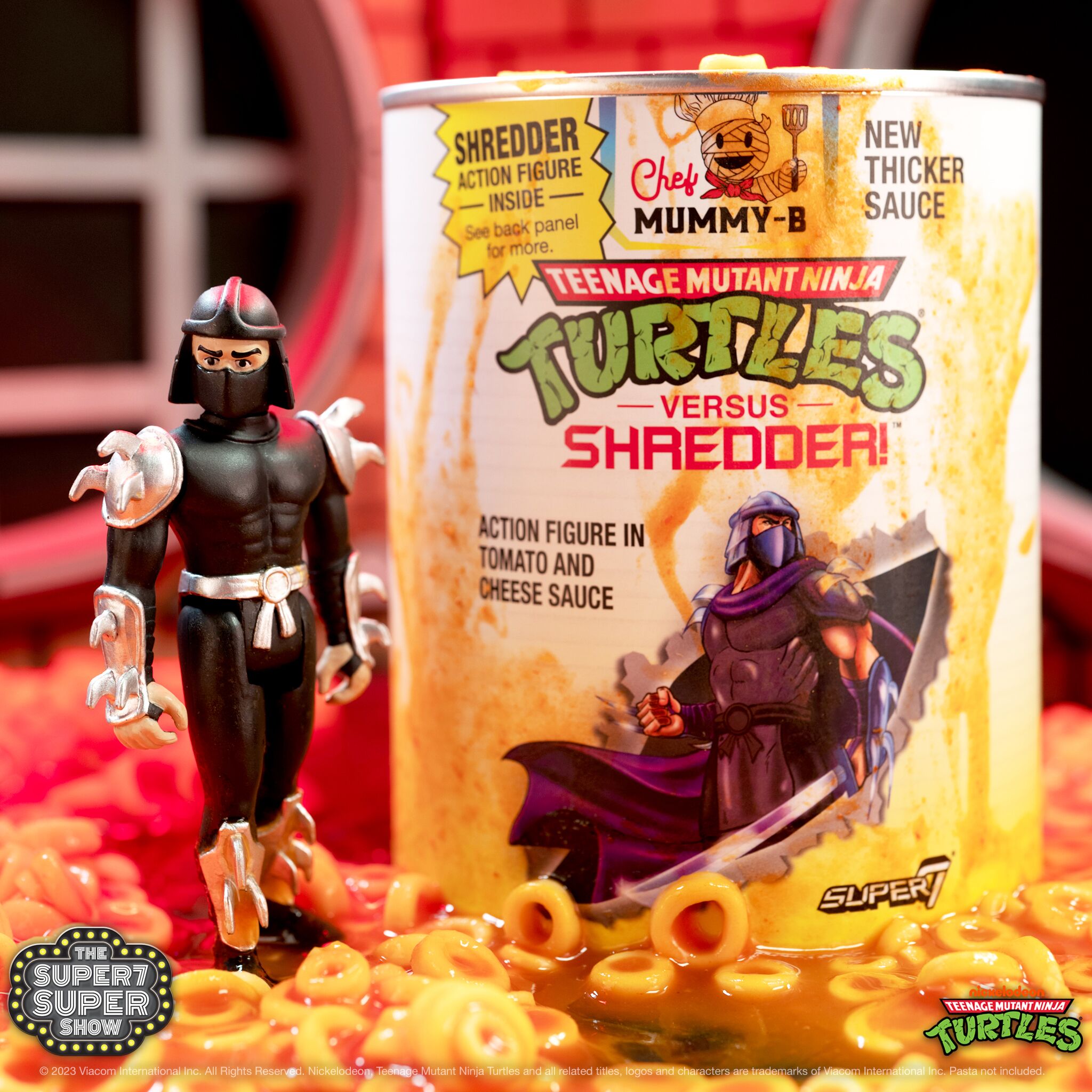 Shredder figure beside a Teenage Mutant Ninja Turtles pasta can with Chef Mummy-B and New Thick Sauce branding