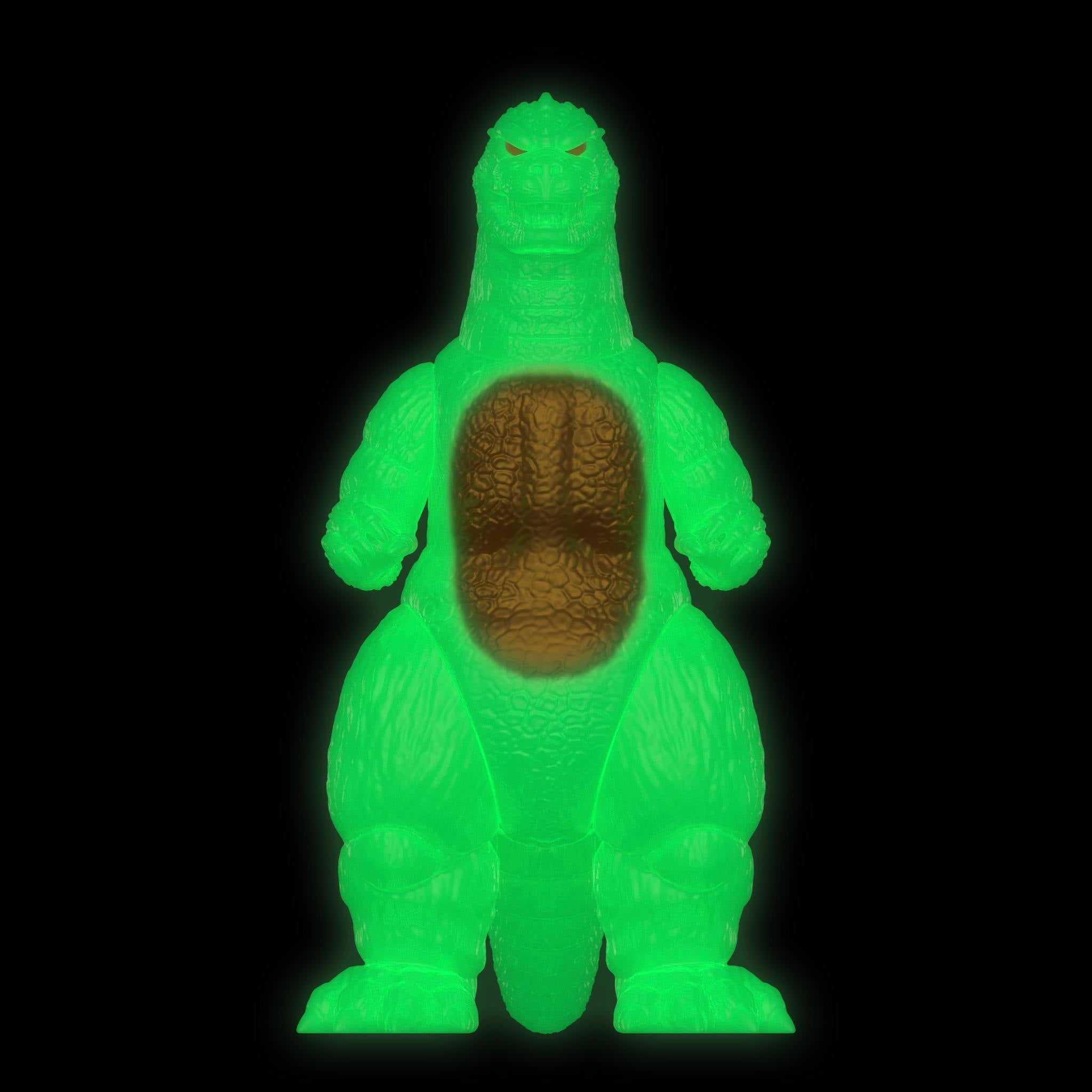 Godzilla 89 glow figure lit in bright green against black backdrop.