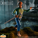 Creature from the Black Lagoon action figure in a green shirt with a silver spear against a moody forest backdrop.