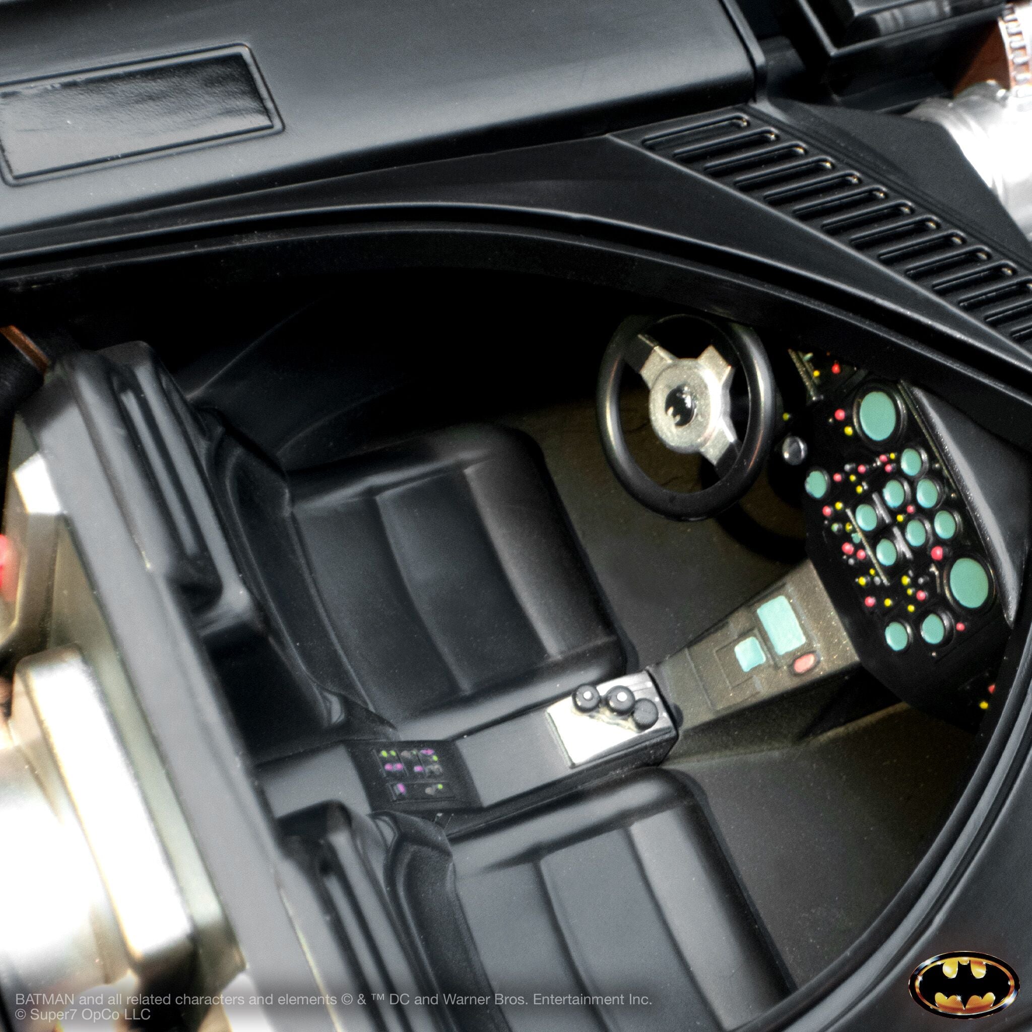 Interior of the 1989 Batmobile from Batman Super Cyborg, showing the steering wheel and dashboard