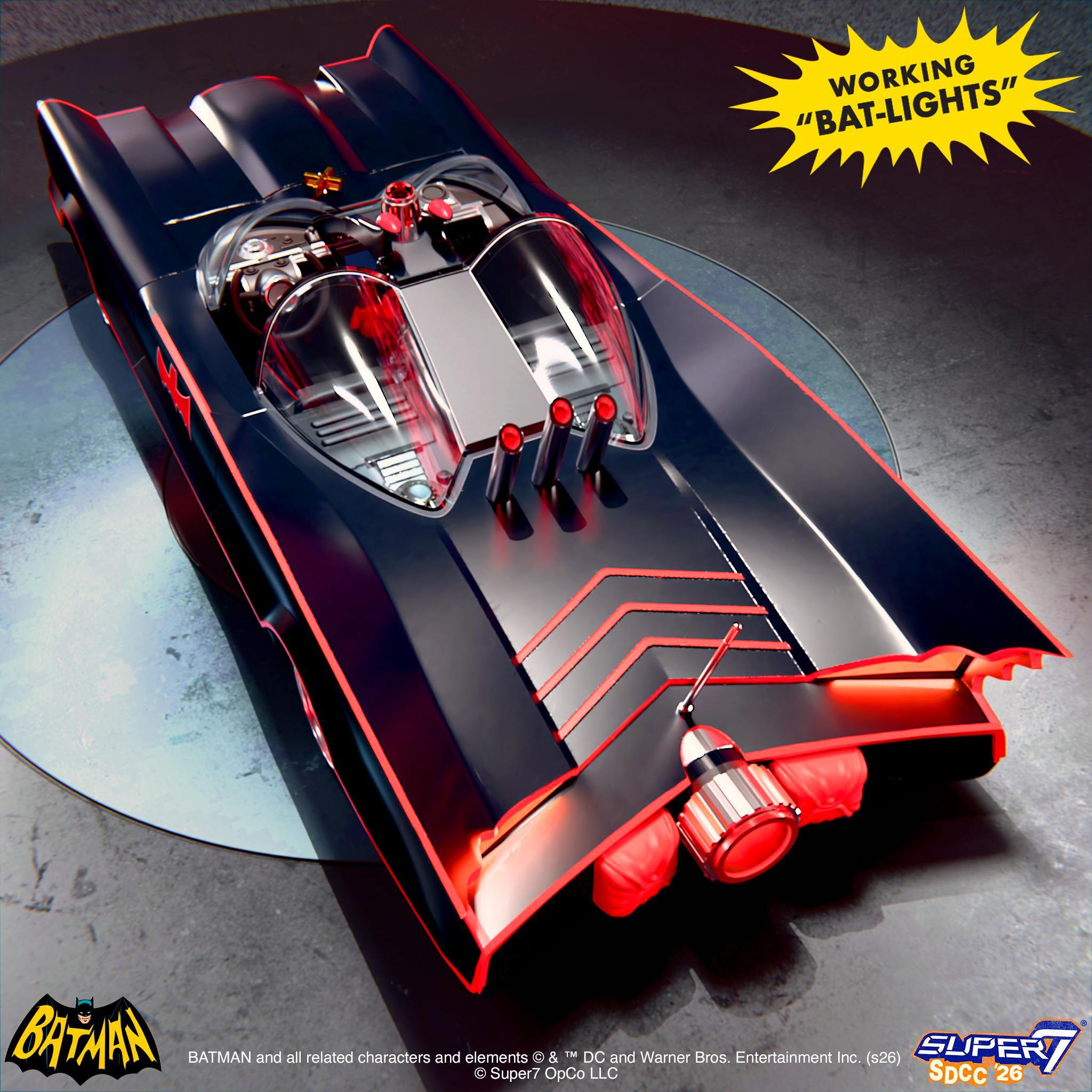 Top view of Batman Batmobile toy in a display box with a yellow burst graphic reading WORKING BAT-LIGHTS
