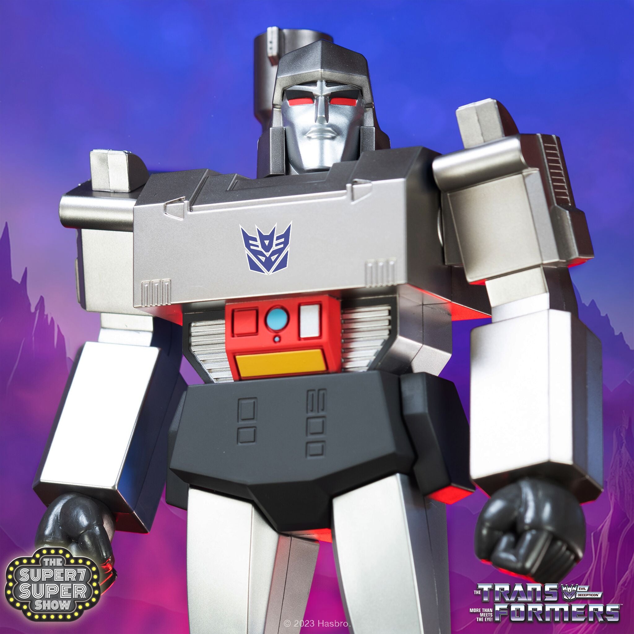 Megatron head and chest in metallic gray with red eyes against a blue background.