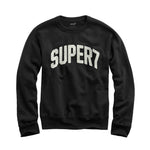 Close-up of black crewneck sweatshirt neckline and shoulder from the Super7 20th Anniversary collection.