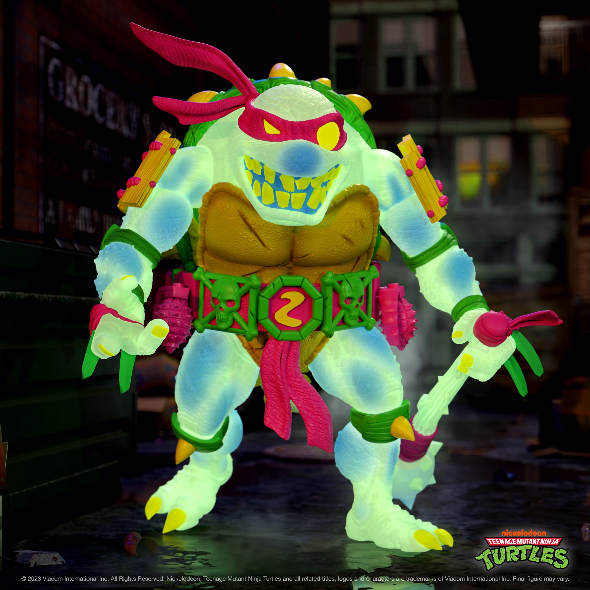 Close up of the neon Slash Glow TMNT figure with pink mask and bright yellow teeth in an urban night scene.