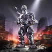 Toho ULTIMATES HeiSei MechaGodzilla action figure standing amid a ruined city backdrop.