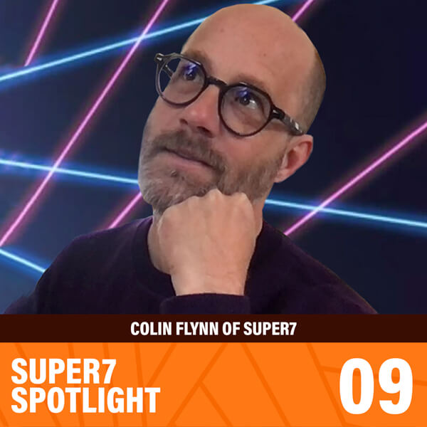 Portrait of a bearded man with glasses in a thoughtful pose, set against neon pink and blue laser lines.
