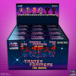 Transformers The Movie 40th Anniversary ReAction Blind Box retail display fully stocked with twelve individual blind boxes on pink grid background