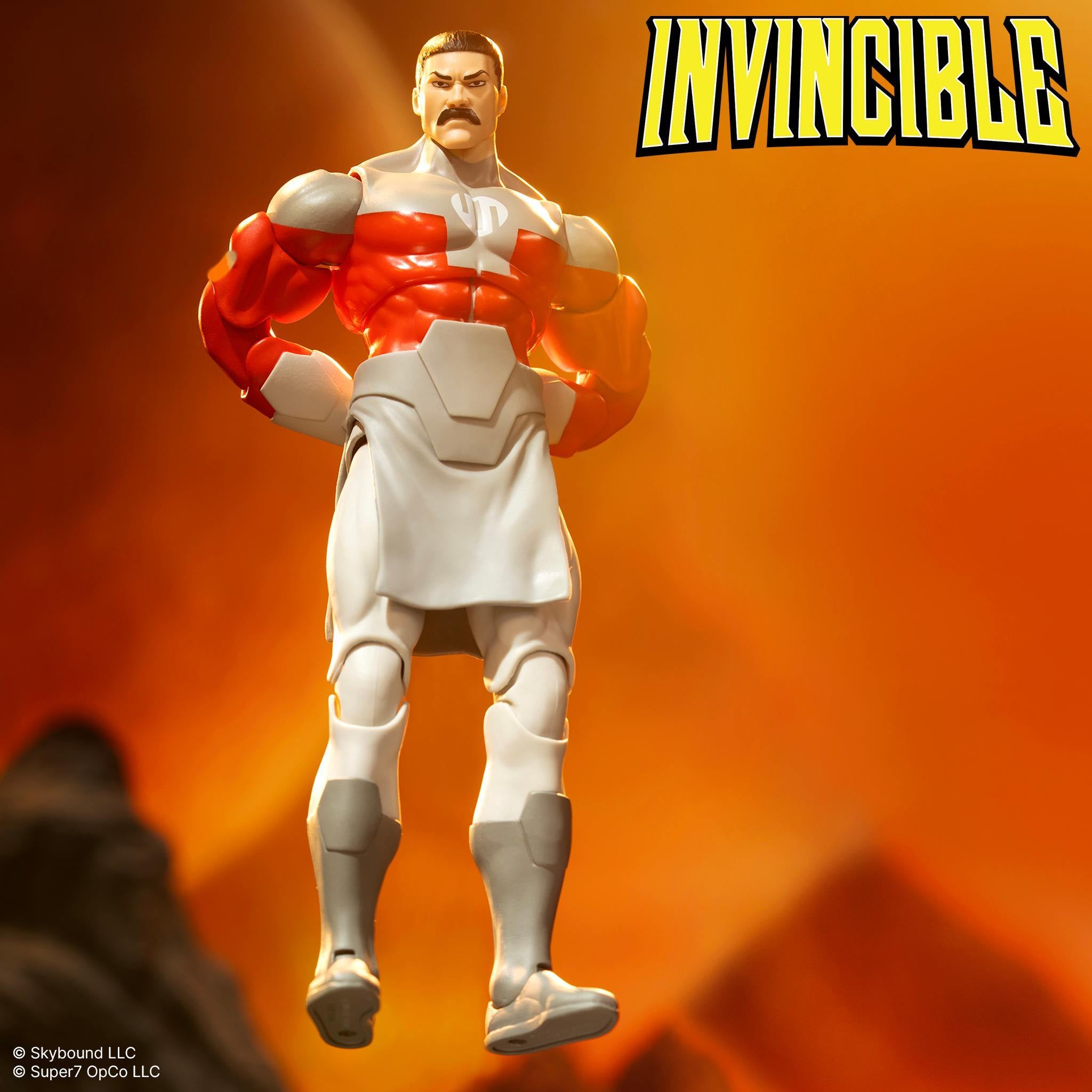 Invincible Thragg 7-inch DX Deluxe action figure standing with arms crossed against a fiery orange background