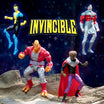 All four Invincible DX Deluxe Wave 1 action figures posed together on rocky terrain in space