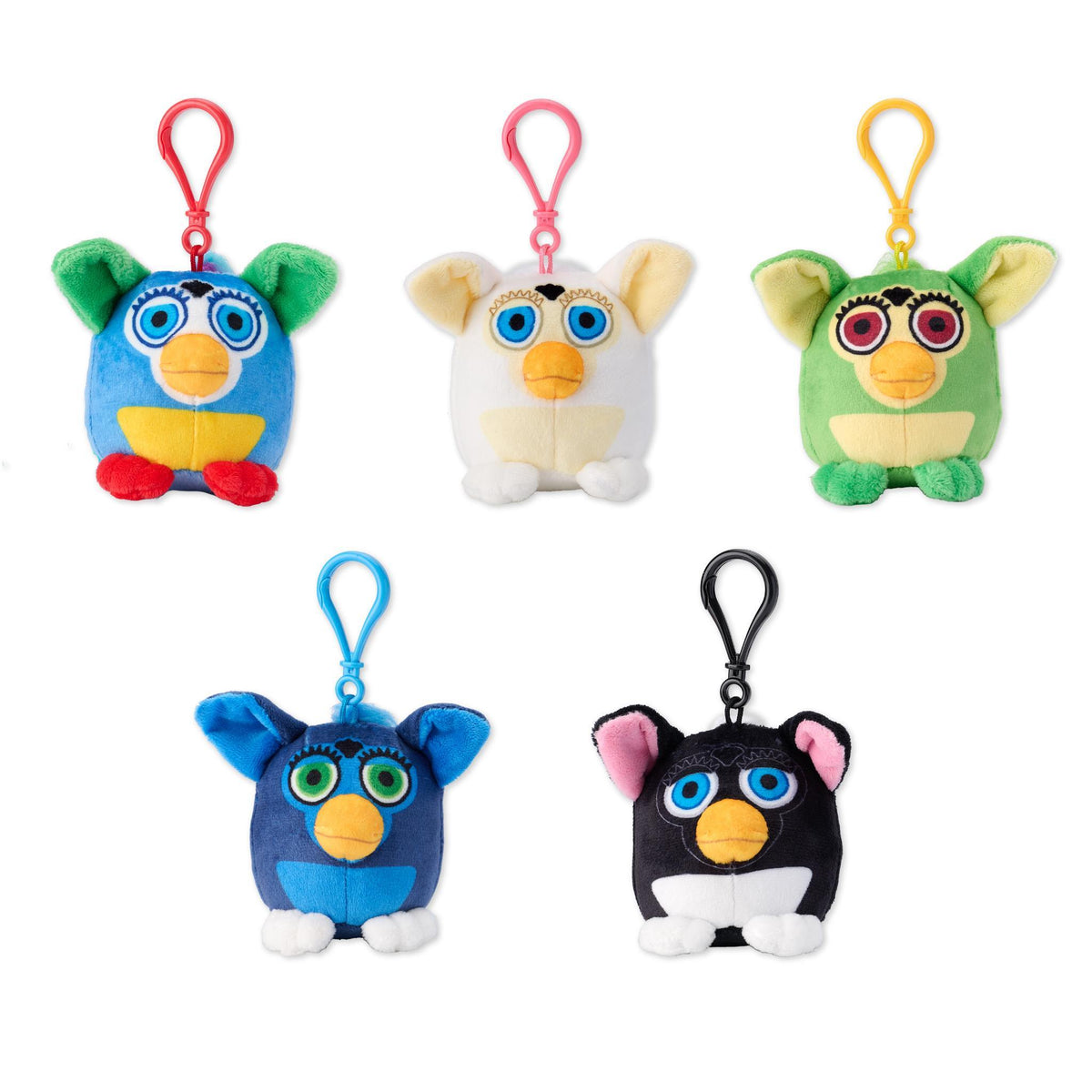 Three Furby plush keychains in blue white and green with colored loops at the top.