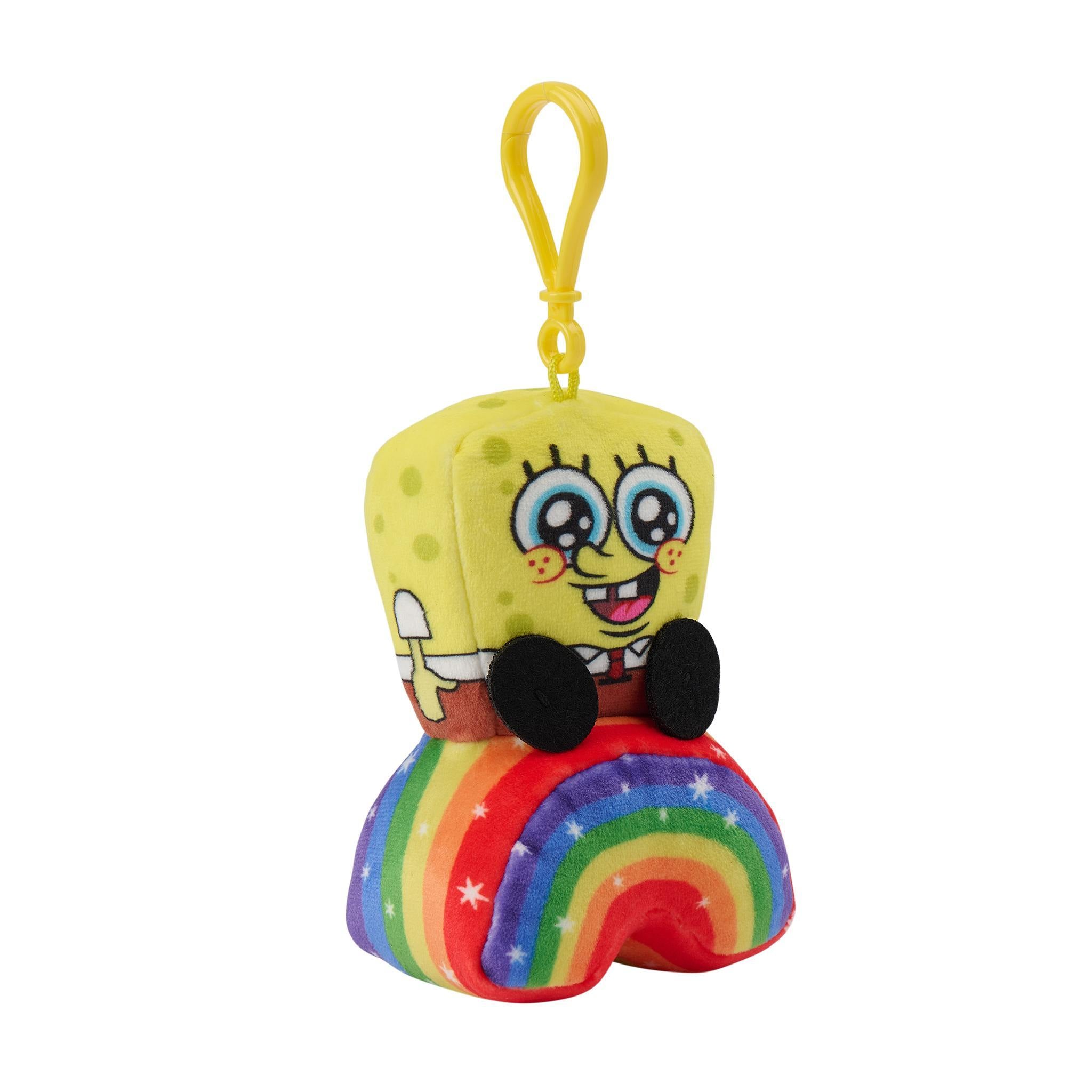 SpongeBob SquarePants plush keychain sitting on a rainbow