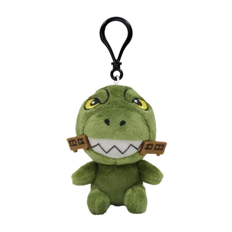 Green Godzilla plush keychain with yellow eyes white zigzag teeth and a black clip