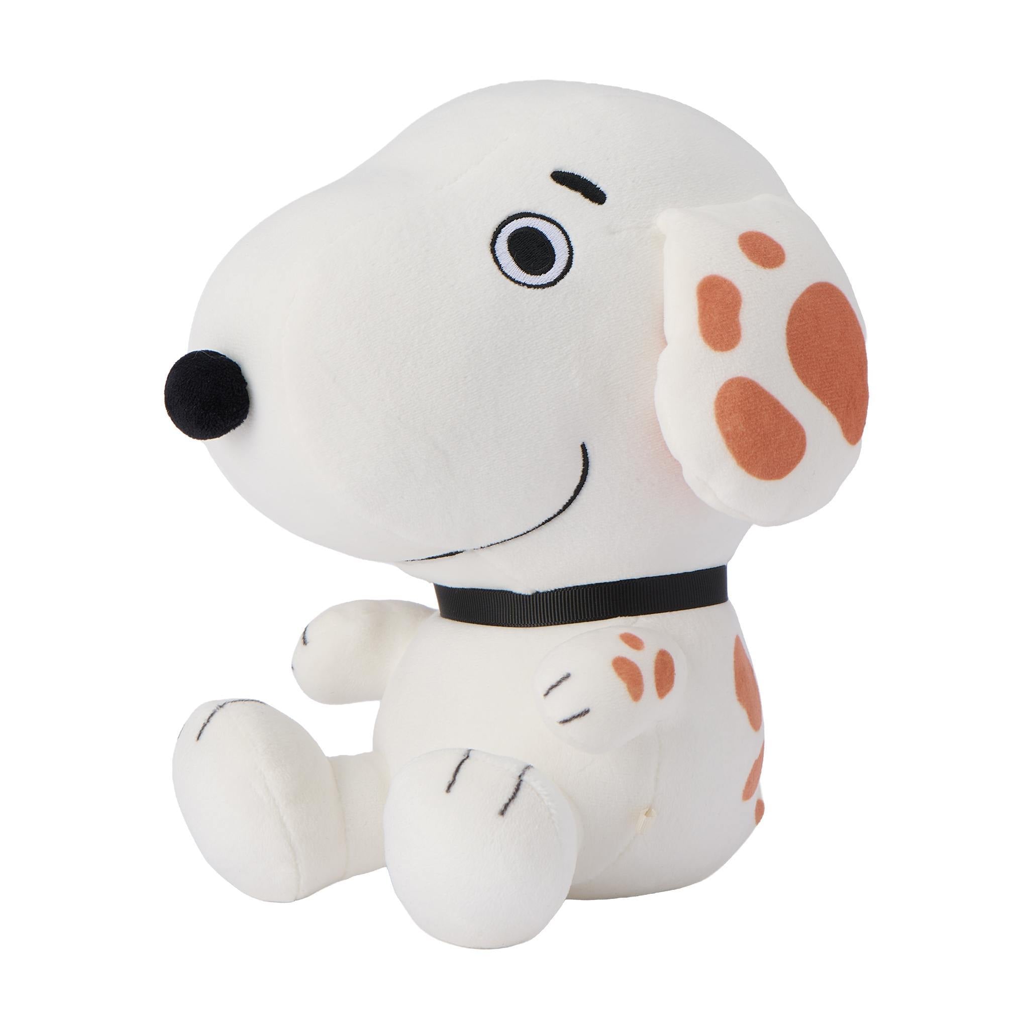 Marbles the Peanuts plush dog with white fur orange polka dot ear and blue neck ribbon