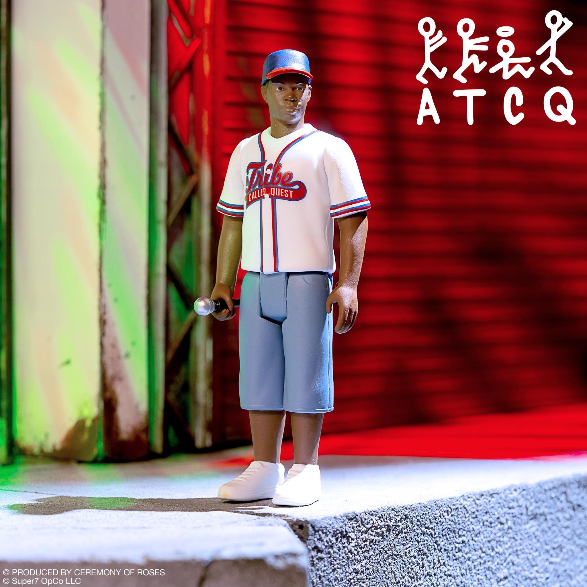 Tribe Called Quest Wave 2 Phife Dawg ReAction Figure in white Tribe Called Quest jersey holding a microphone, urban backdrop