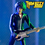 Phil Lynott action figure in a black leather outfit playing a bass on stage