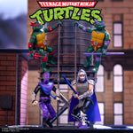 Teenage Mutant Ninja Turtles ReAction+ Wave 01 display with Raphael and Donatello atop a metal tower, Shredder and Foot Ninja below.