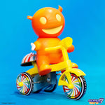Super7 Super Cycles Mummy Boy (Orange w/ Yellow Trike) on a blue background