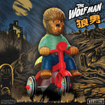 The Wolf Man (Brown w/ Red Trike) on a red tricycle in a graveyard under a full moon
