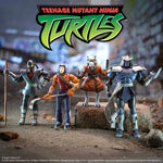 Packaging for Teenage Mutant Ninja Turtles Ultimates Wave 13 with bold orange logo panel and figures visible inside the display window