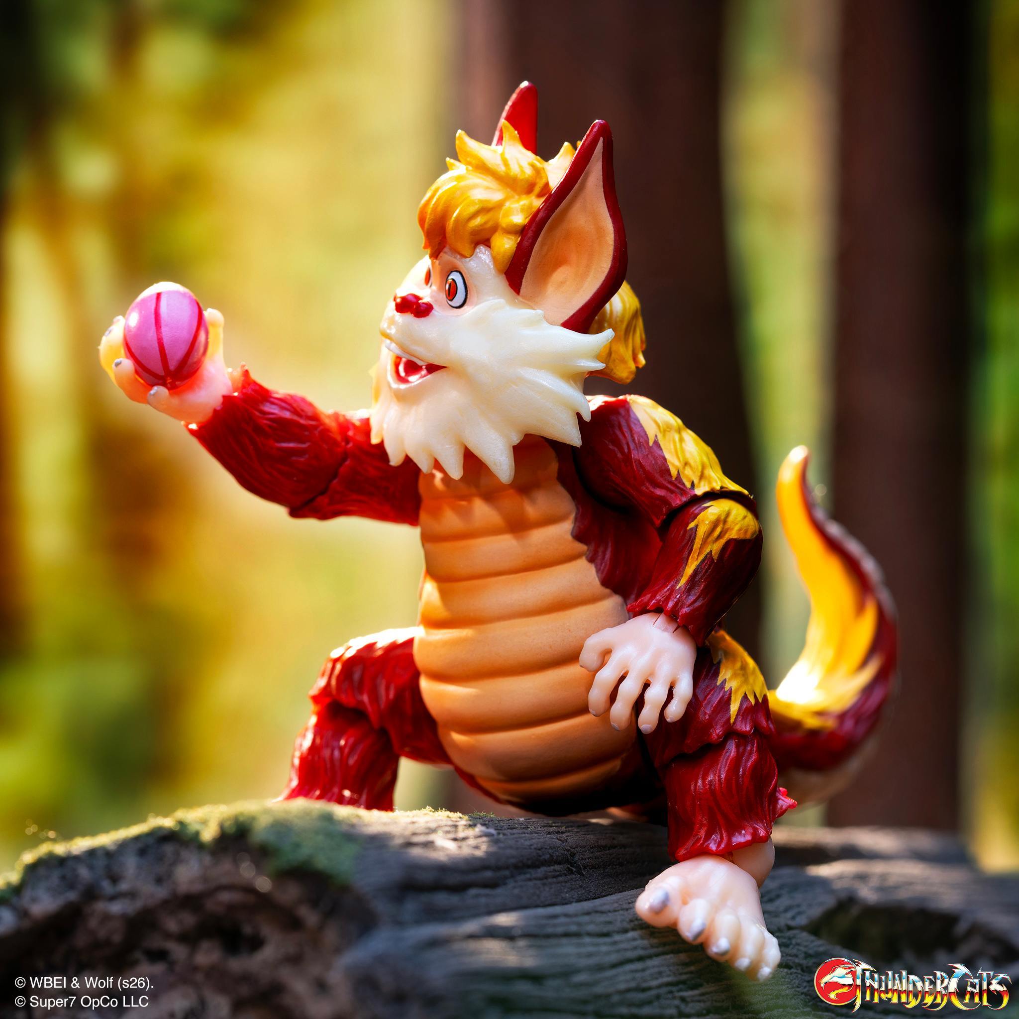 Close up of ThunderCats ULTIMATES Snarf figure holding a pink striped egg.